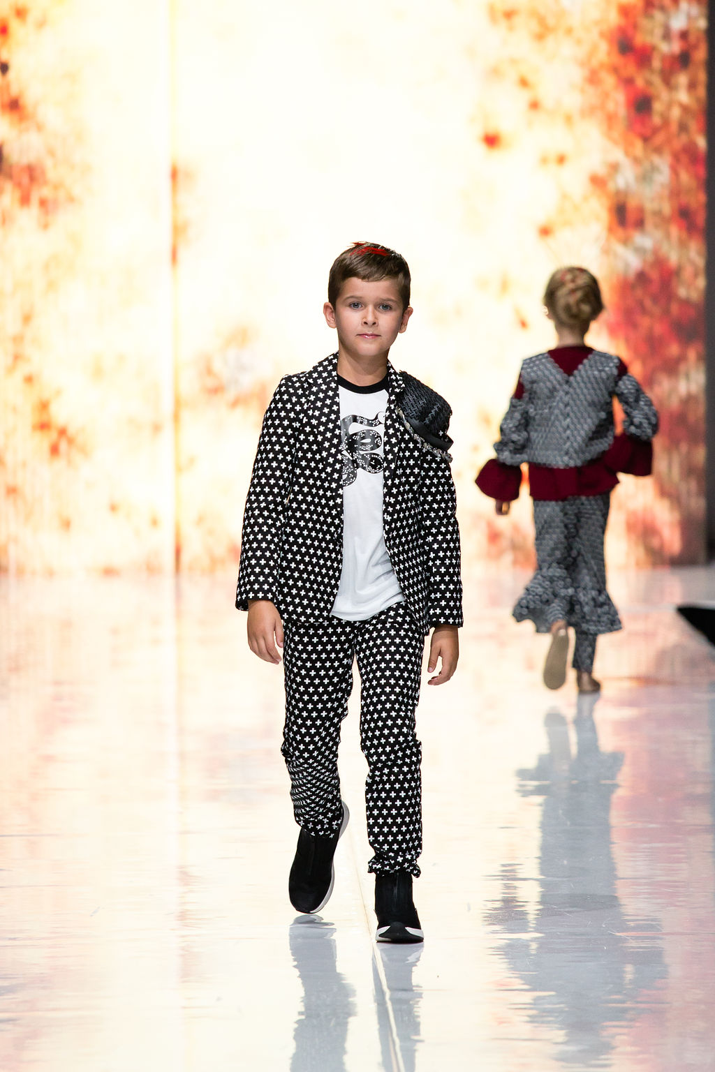 Young walks the runway wearing the plus print Suit Blazer and Pant with a Snake T-Shirt