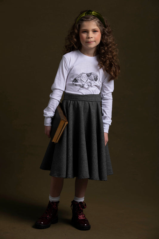 With book in hand, this young lady poses in her lorek shirt coordinated with her scholars skirt