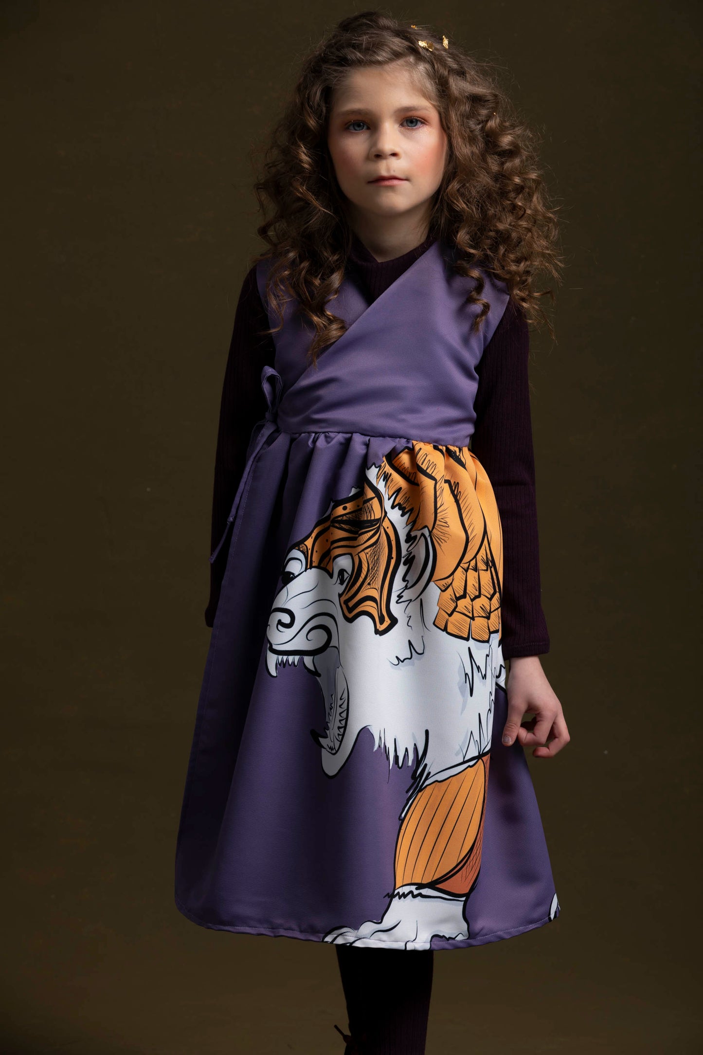 This young sweetheart shows off her purple knit tunic with the lorek dress 