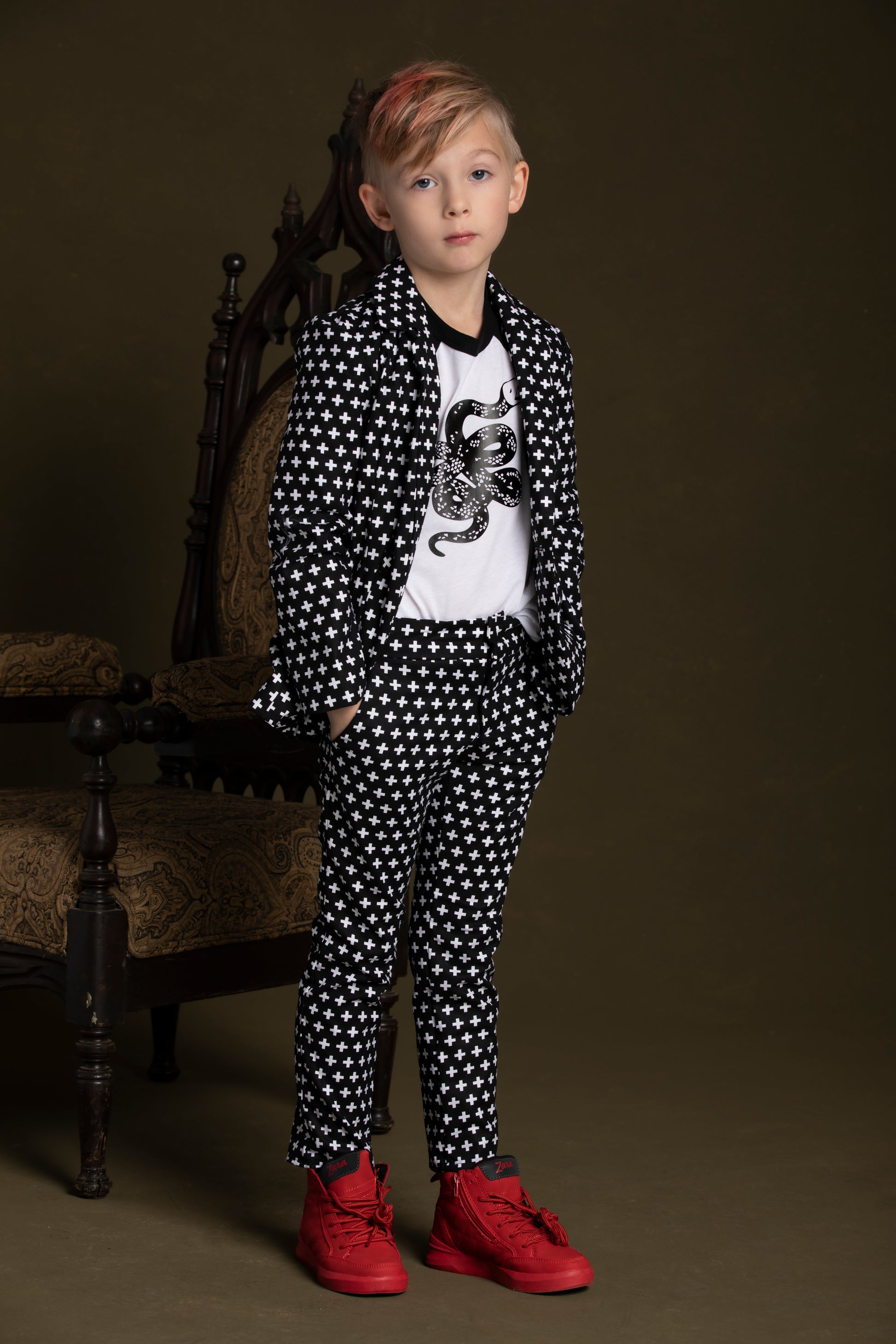 Young boy poses the Plus Print Blazer alongside a Snake T-Shirt, Suit Vest, and matching Suit Pants